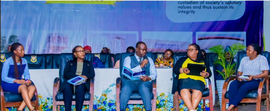 Panel members seated on stage during a round-table discussion on adolescent and youth health.